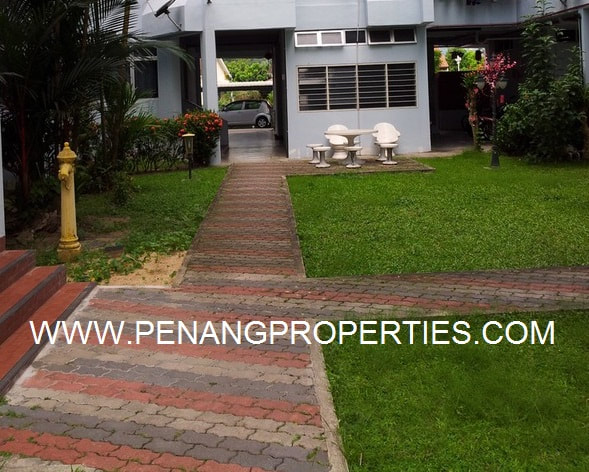 Paved walkway and grass garden